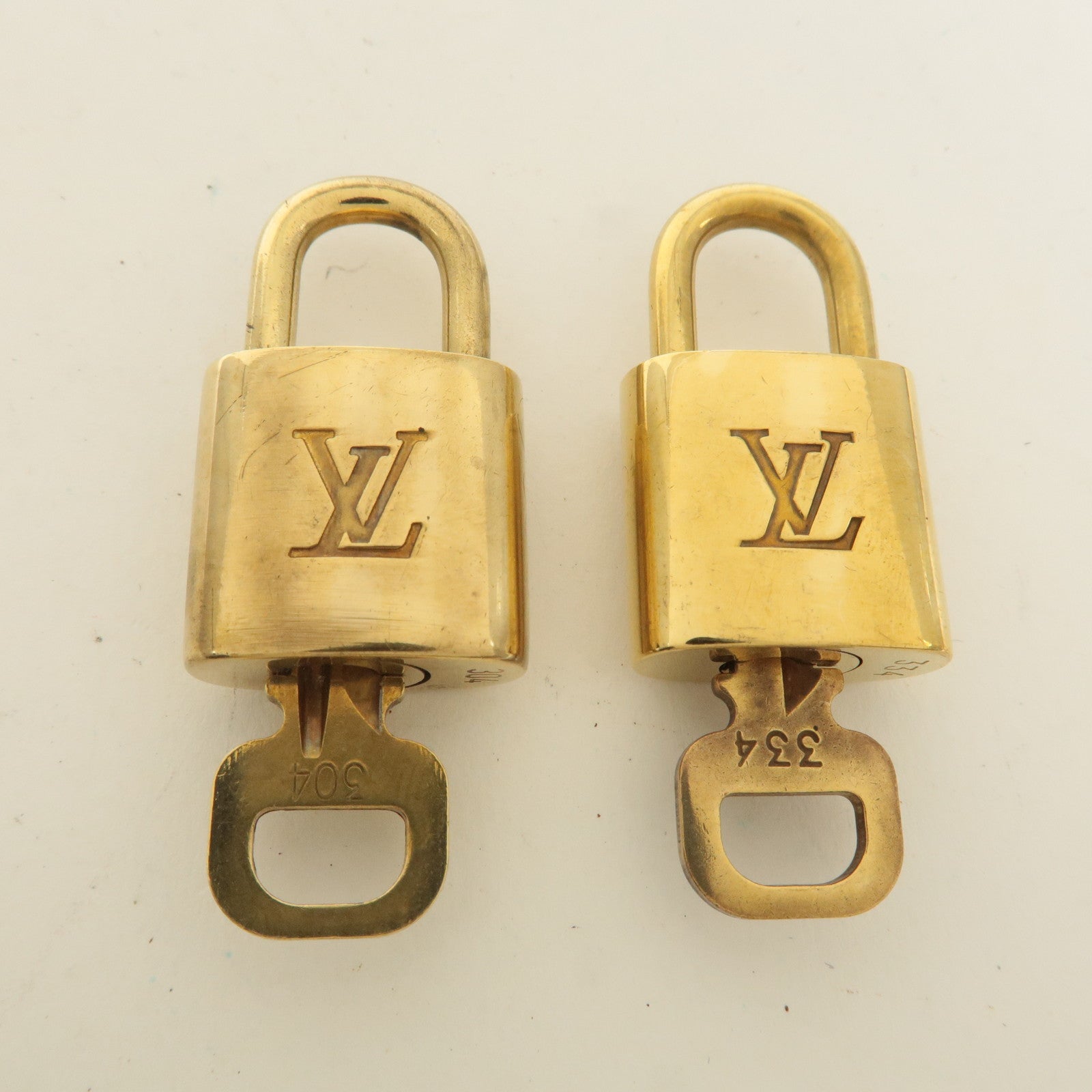 Louis Vuitton Set of 10 Lock 
Key Cadena Key Lock Gold