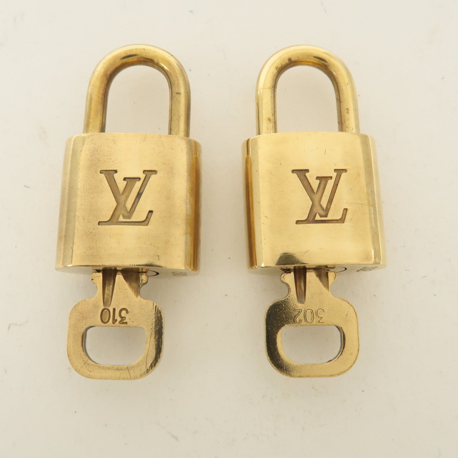 Louis Vuitton Set of 10 Lock 
Key Cadena Key Lock Gold