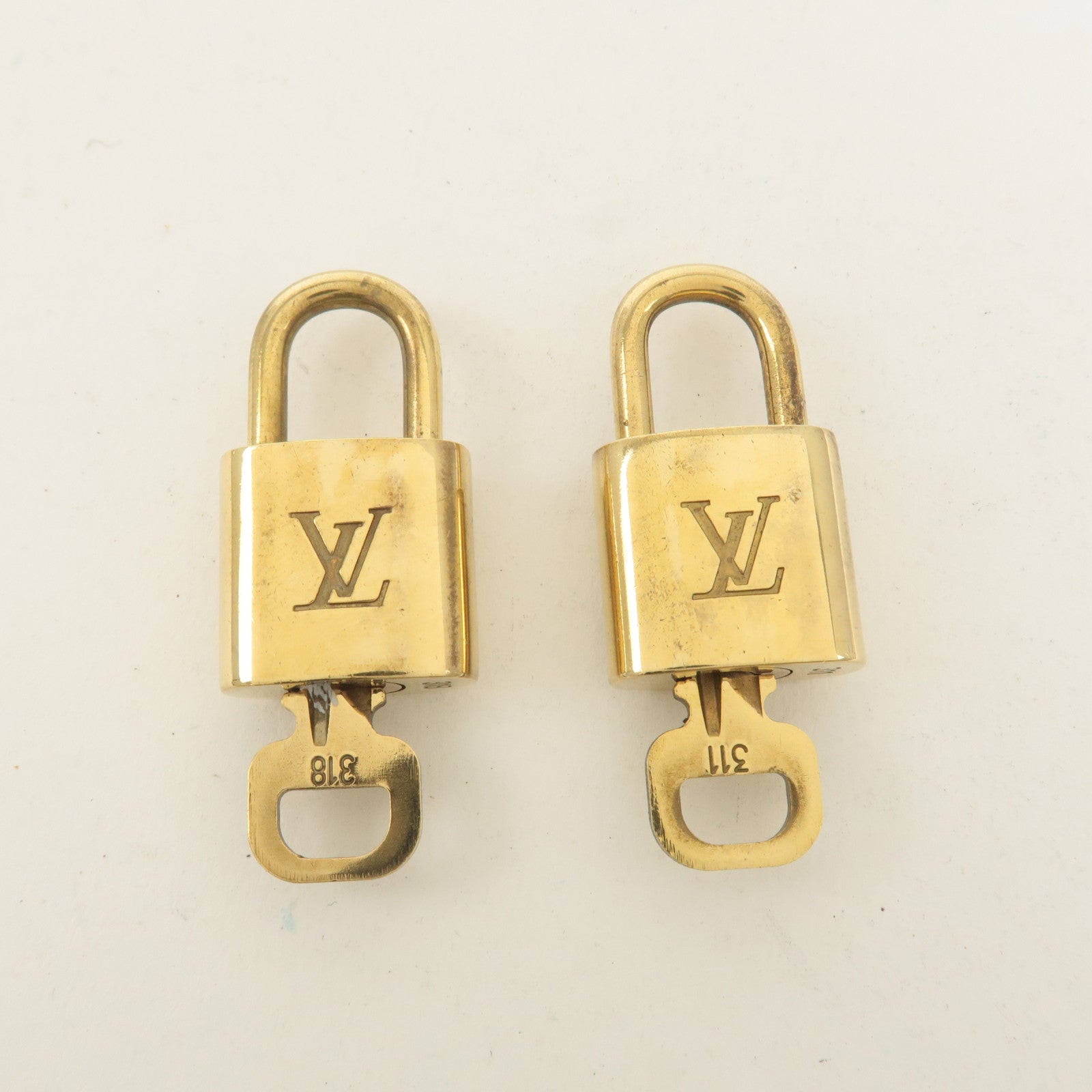 Louis Vuitton Set of 10 Lock 
Key Cadena Key Lock Gold