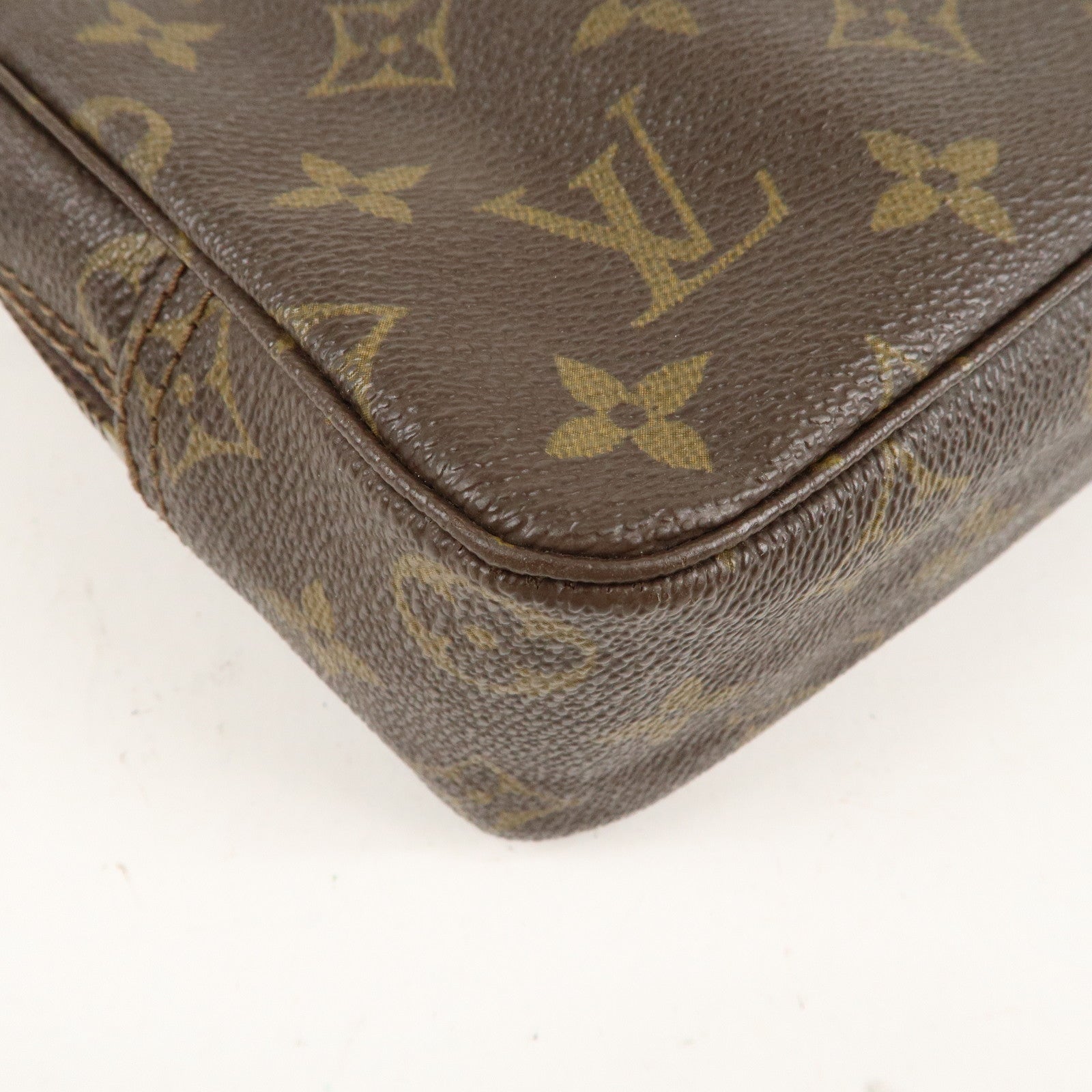 is Vuitton Monogram Trousse Toilette 23 Cosmetic Pouch M47524