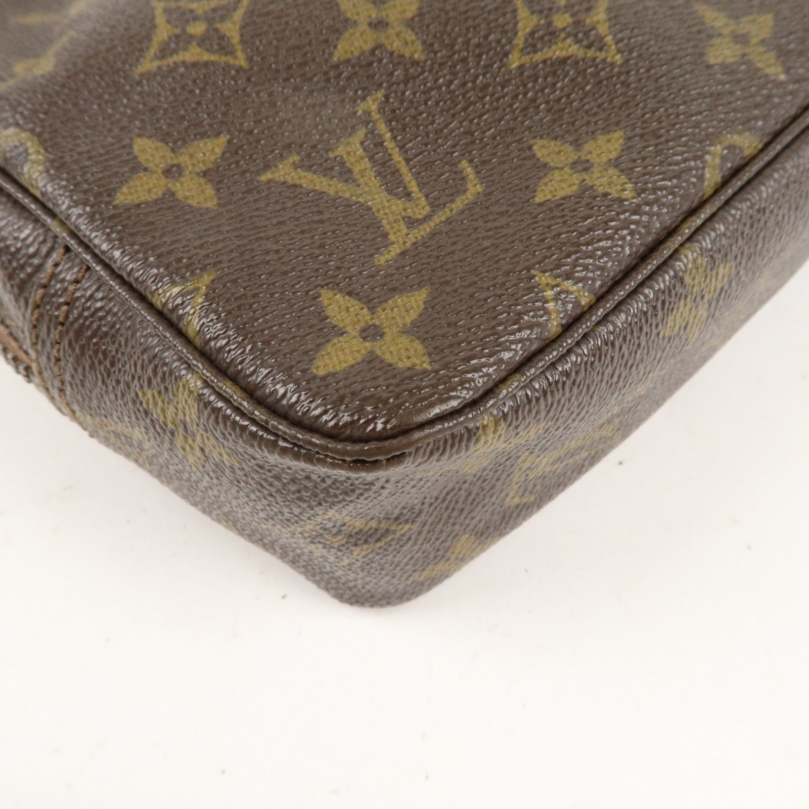 is Vuitton Monogram Trousse Toilette 23 Cosmetic Pouch M47524