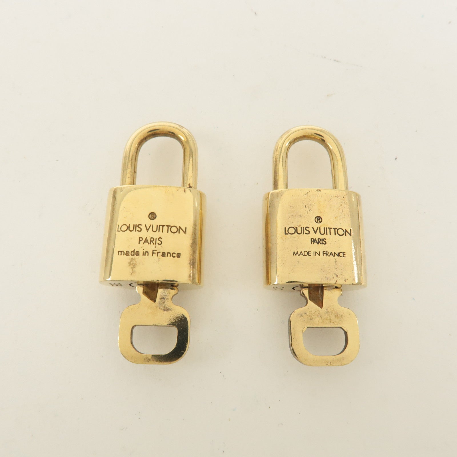 Louis Vuitton Set of 10 Lock 
Key Cadena Key Lock Gold