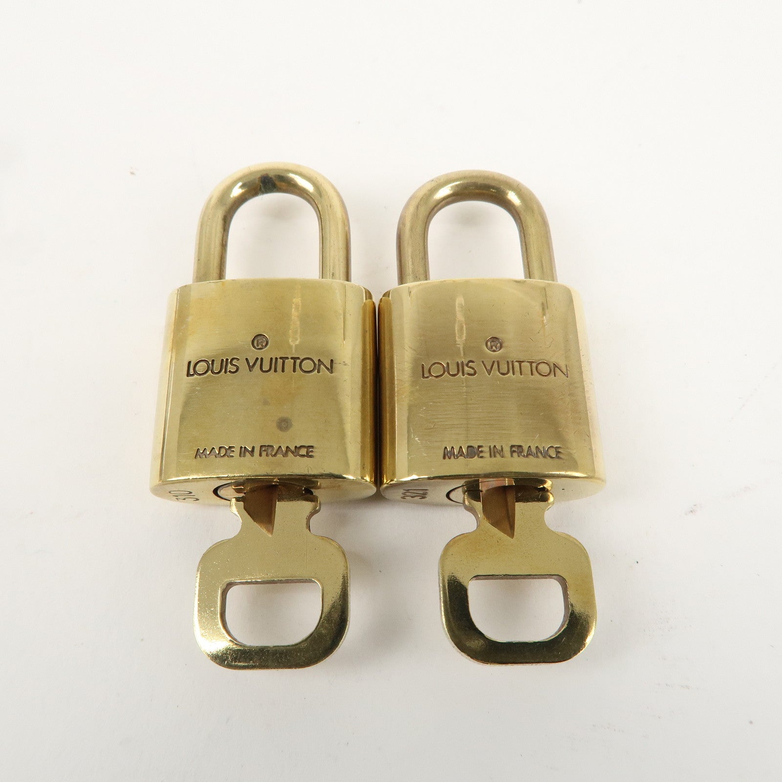 Louis Vuitton Set of 10 Lock 
Key Cadena Key Lock Gold