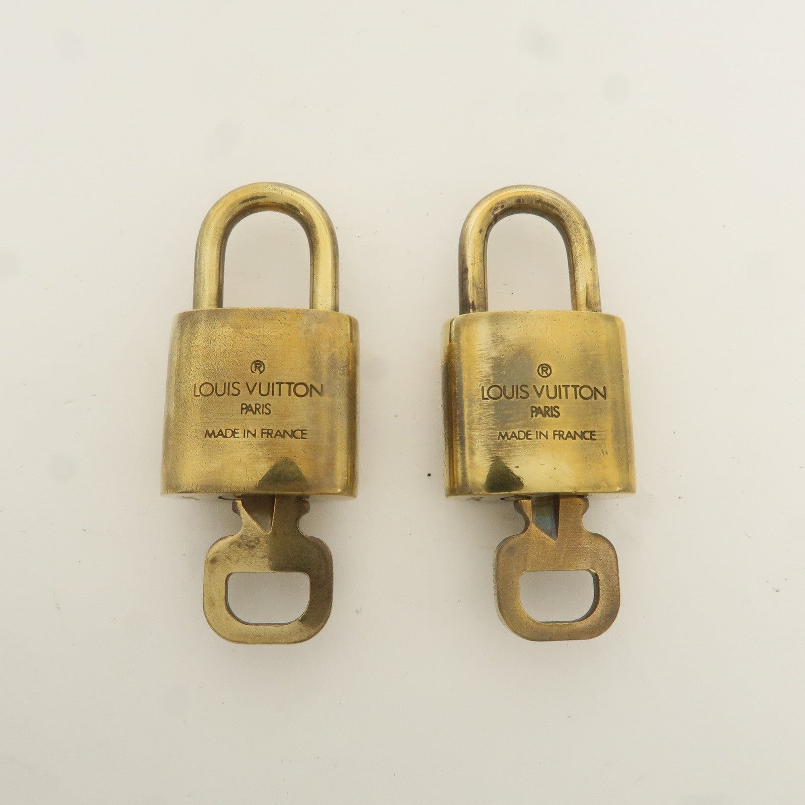 Louis Vuitton Set of 10 Lock 
Key Cadena Key Lock Gold