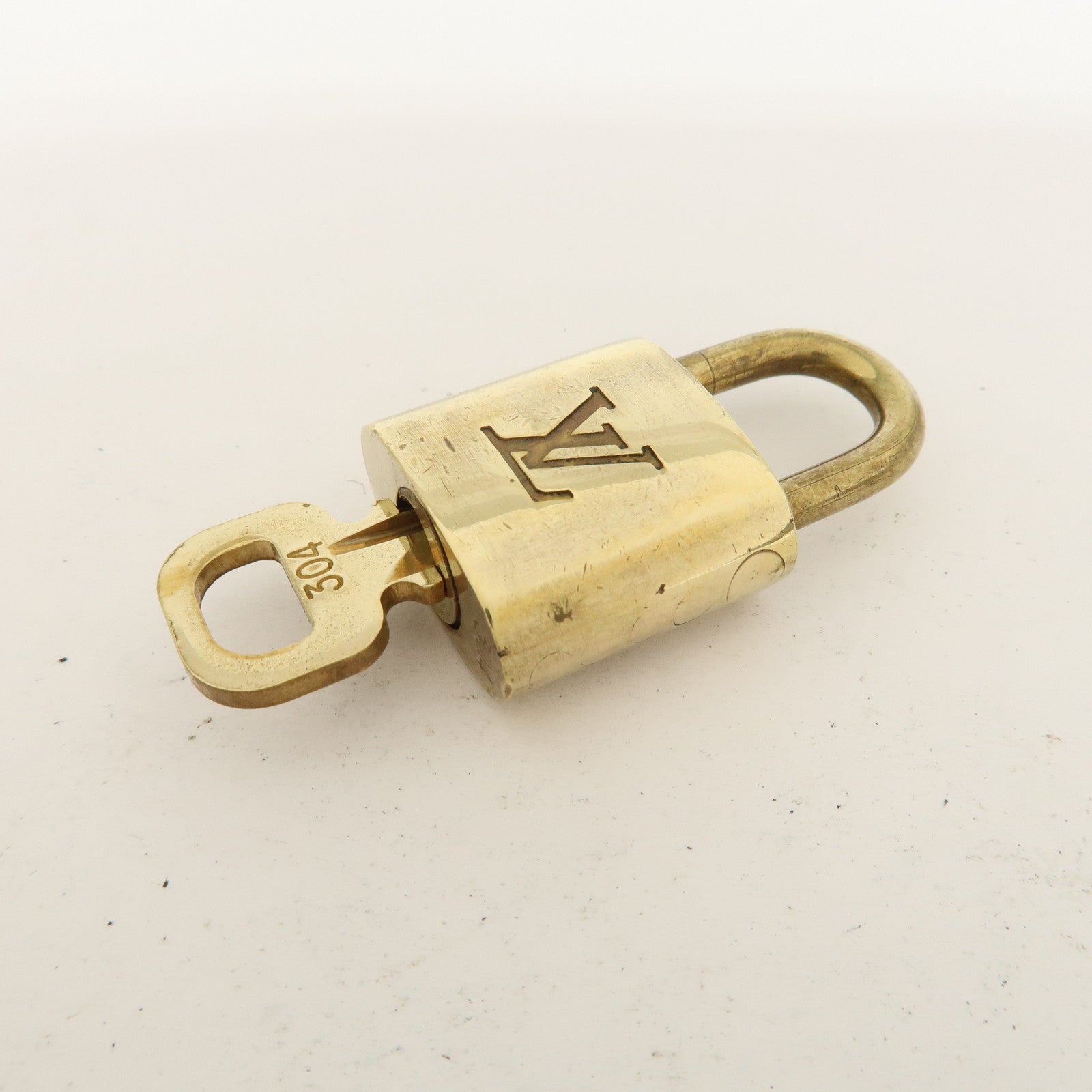 Louis Vuitton Set of 10 Lock 
Key Cadena Key Lock Metal Gold