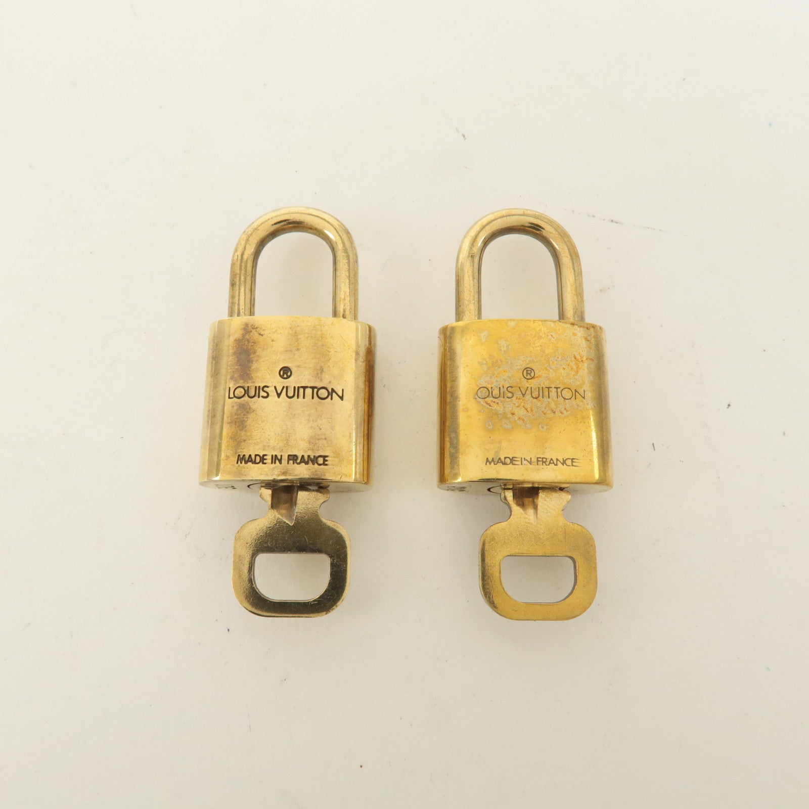 Louis Vuitton Set of 10 Lock 
Key Cadena Key Lock Gold