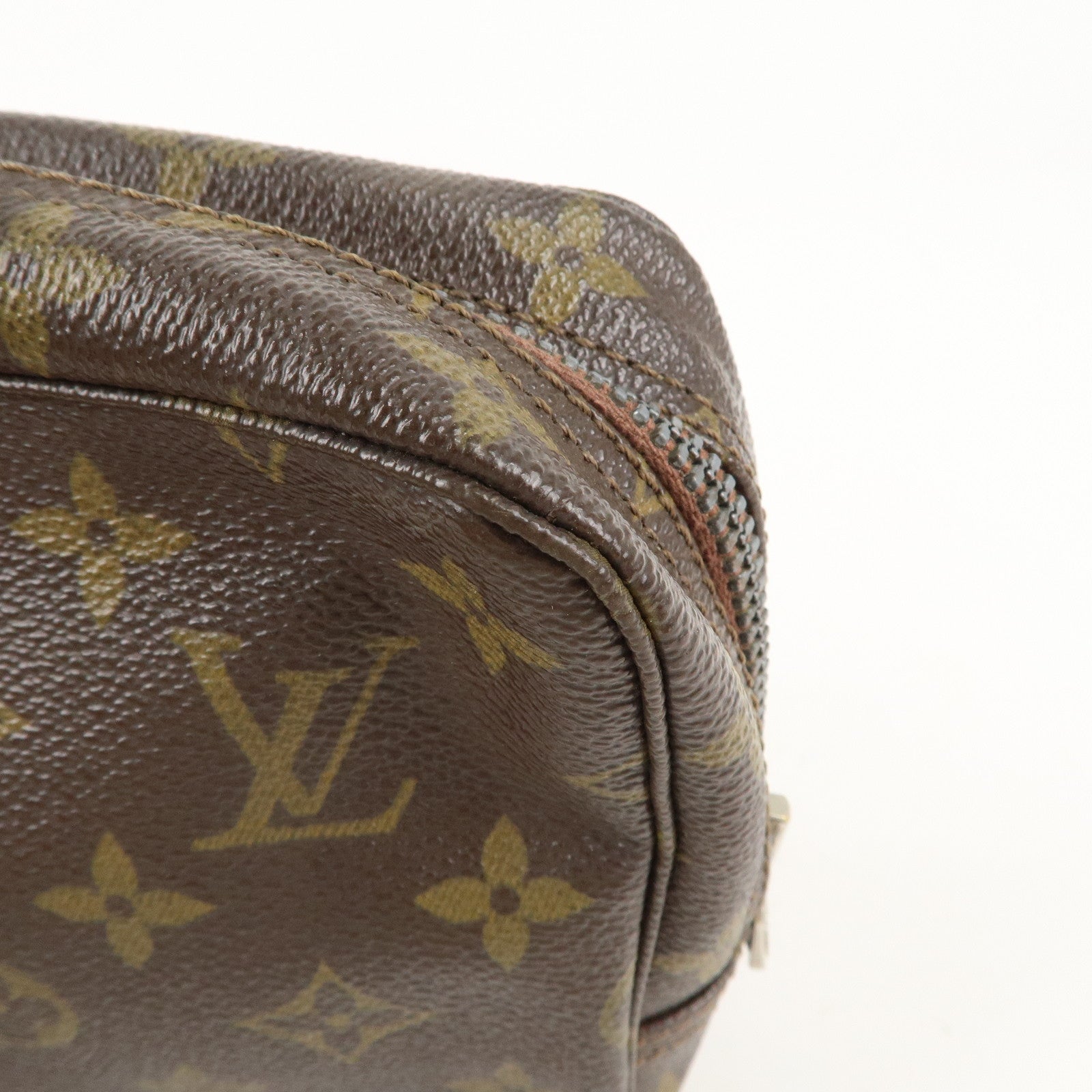 is Vuitton Monogram Trousse Toilette 23 Cosmetic Pouch M47524