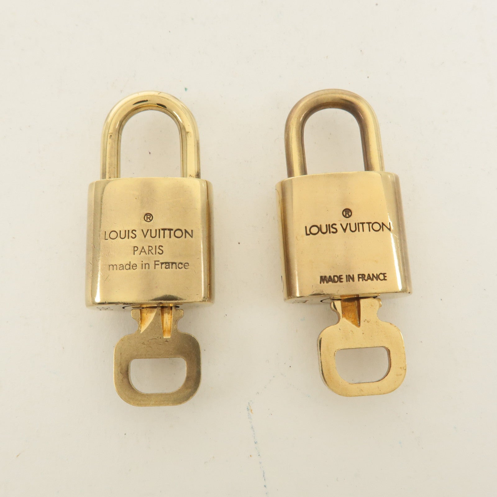 Louis Vuitton Set of 10 Lock 
Key Cadena Key Lock Gold