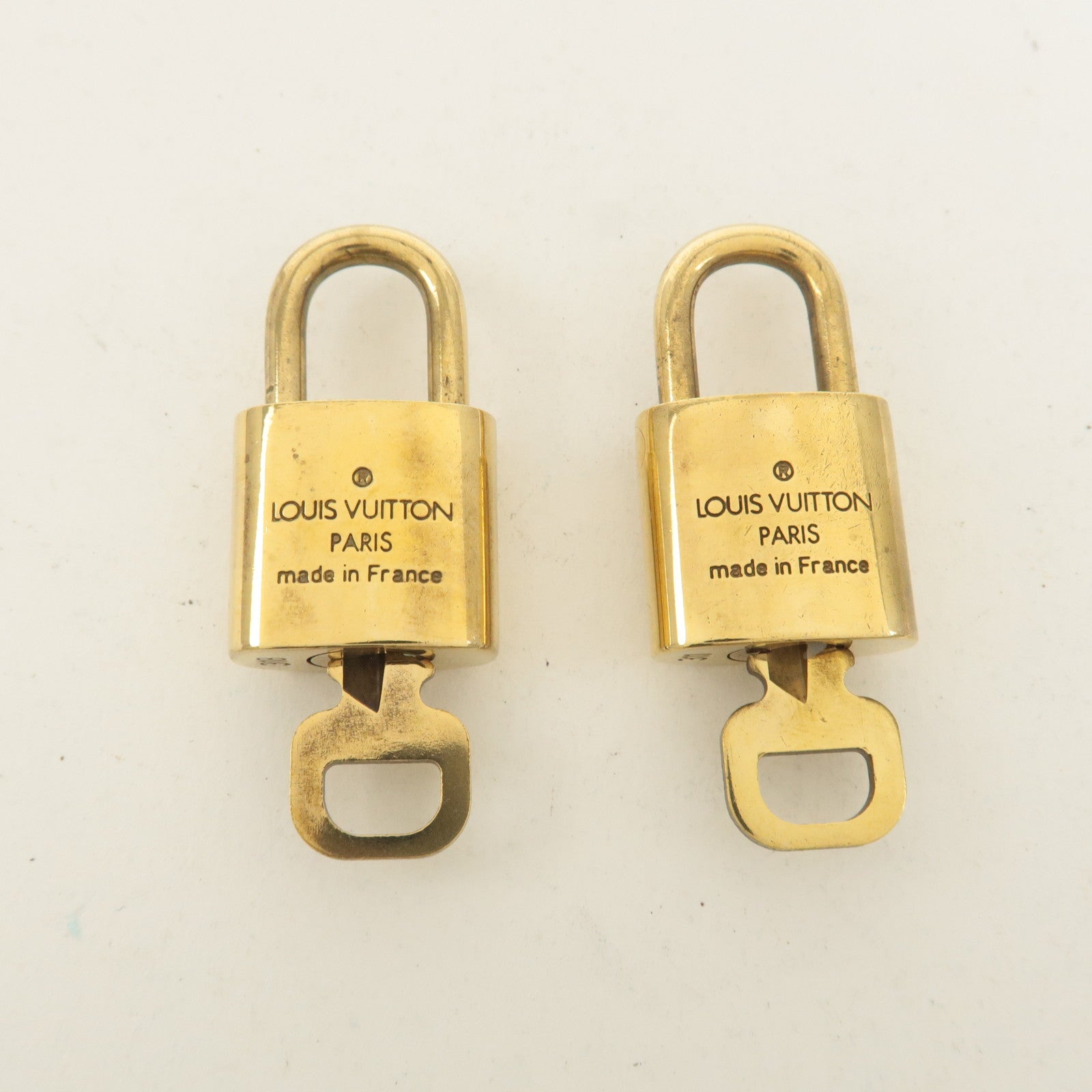 Louis Vuitton Set of 10 Lock 
Key Cadena Key Lock Gold