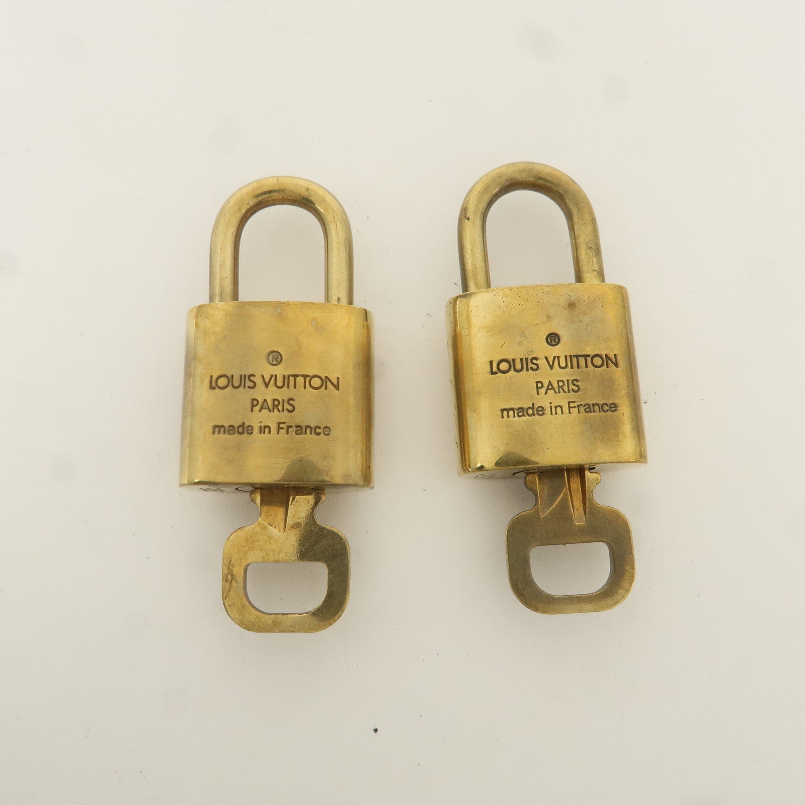 Louis Vuitton Set of 10 Lock 
Key Cadena Key Lock Gold