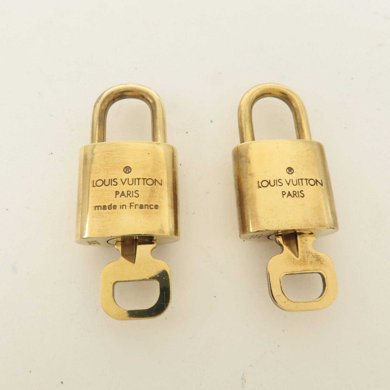 Louis Vuitton Set of 10 Lock 
Key Cadena Key Lock Gold