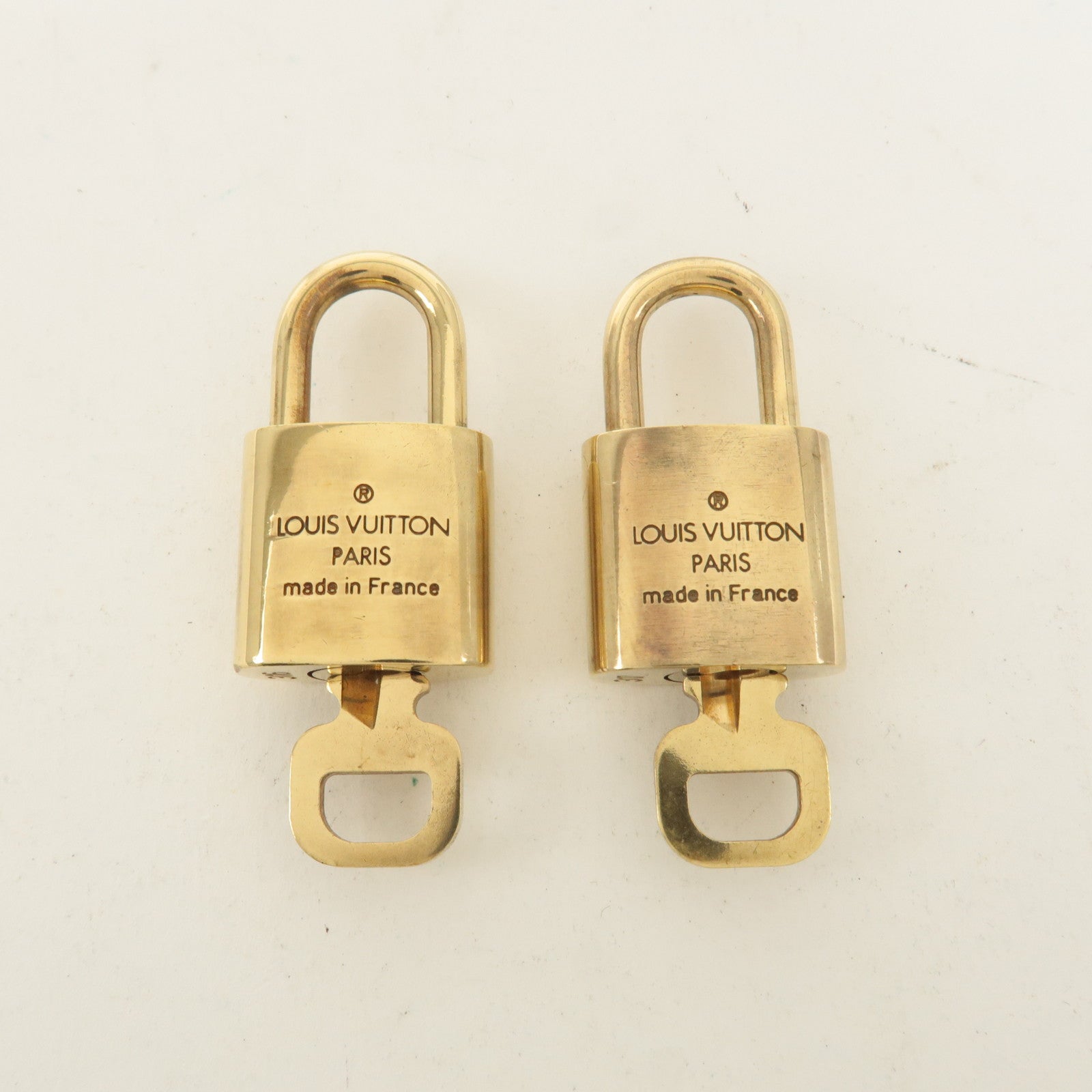 Louis Vuitton Set of 10 Lock 
Key Cadena Key Lock Gold