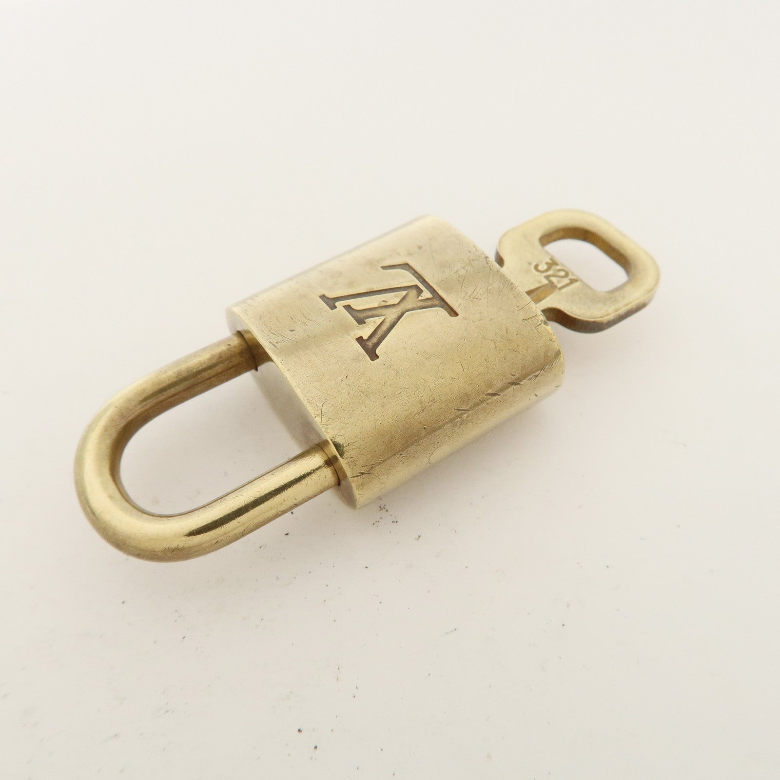 Louis Vuitton Set of 10 Lock 
Key Cadena Key Lock Metal Gold