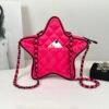 Chanel 24C Fuchsia Satin Walk of Fame Star Bag with Black Lacquered Hardware.