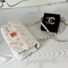 Chanel 24C White Tweed Mini Flap with Orange Enamel CC and Champagne Gold Hardware.