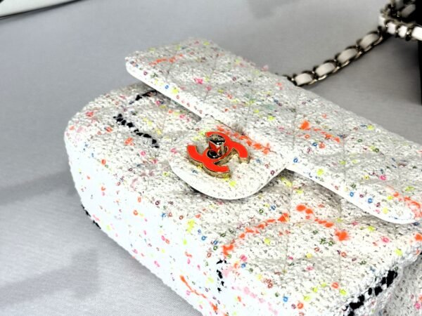 Chanel 24C White Tweed Mini Flap with Orange Enamel CC and Champagne Gold Hardware.