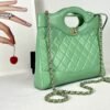 Chanel 24S Green Shiny Lambskin Mini 31 Bag with Champagne Gold Hardware.