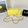 Chanel 24S Yellow Iridescent Lambskin Pearl Twin Flap Bag.