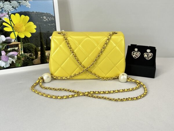 Chanel 24S Yellow Iridescent Lambskin Pearl Twin Flap Bag.