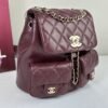 Chanel 24A Burgundy Caviar Medium Duma Backpack.