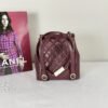 Chanel 24A Burgundy Caviar Medium Duma Backpack.